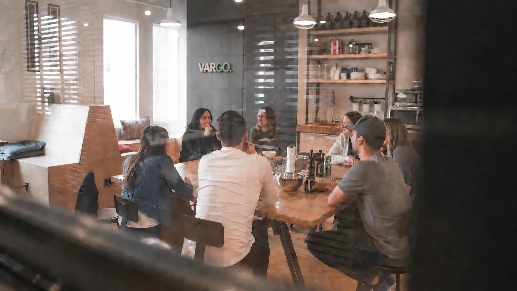 Vargo team in a meeting room with a subtle Vargo sign on the rear wall